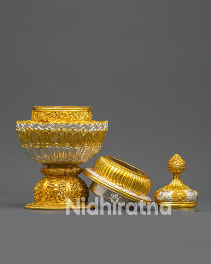 Close up Neshi rice pot lid and jewel finial with gold and silver plated detailing