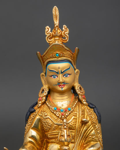 Close up Padmasambhava gold-painted face with semi-precious stones Newari craftsmanship