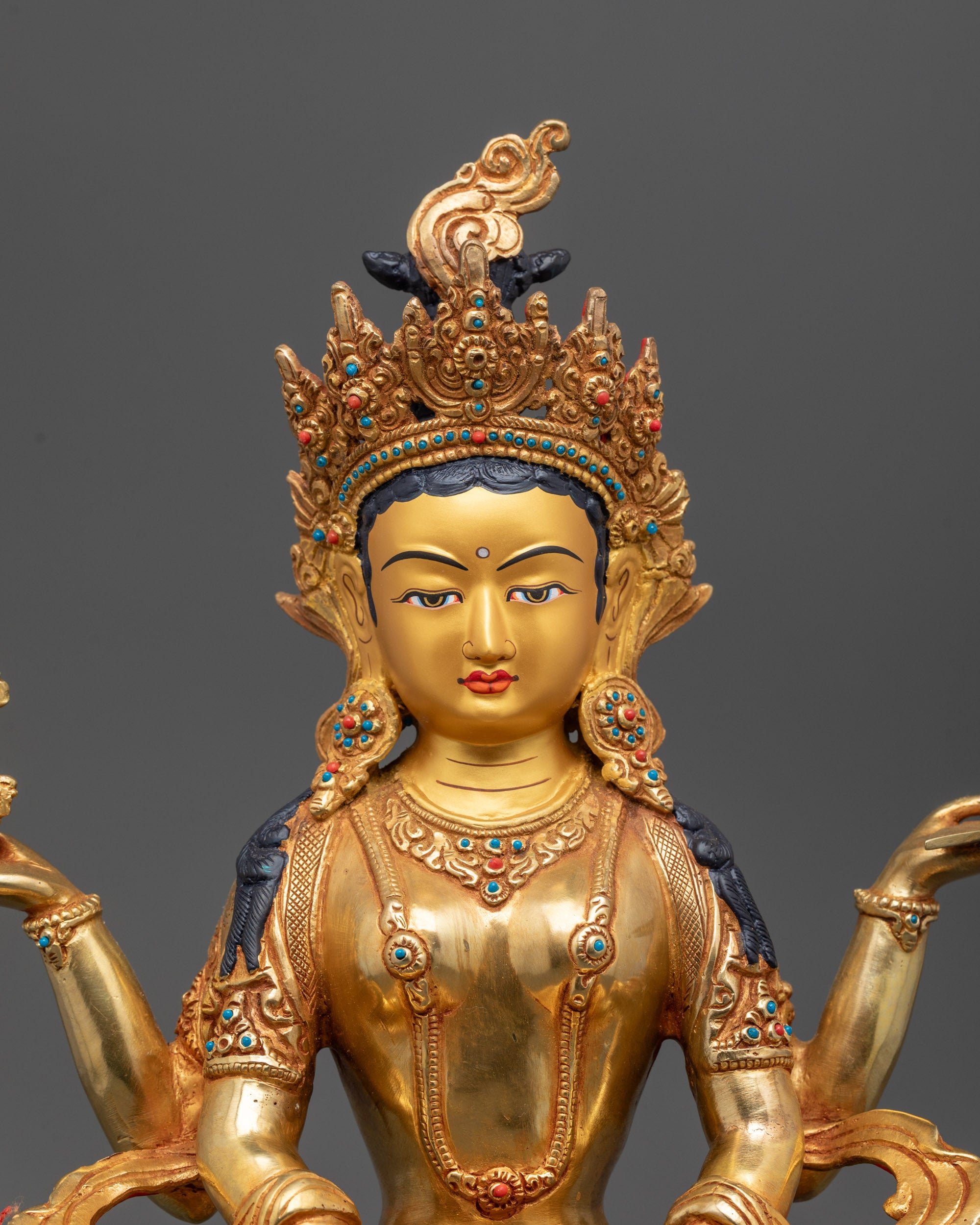 Close up Prajna Paramita Statue showing intricate carvings and semi-precious stones