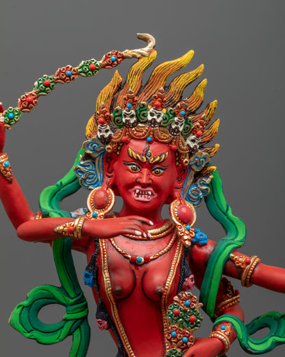 Close up Red-painted Kurukulla Sculpture adorned with semi-precious stones