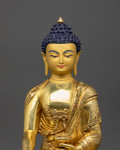 Close up Samana Gotama Buddha intricately carved robe with semi-precious stones