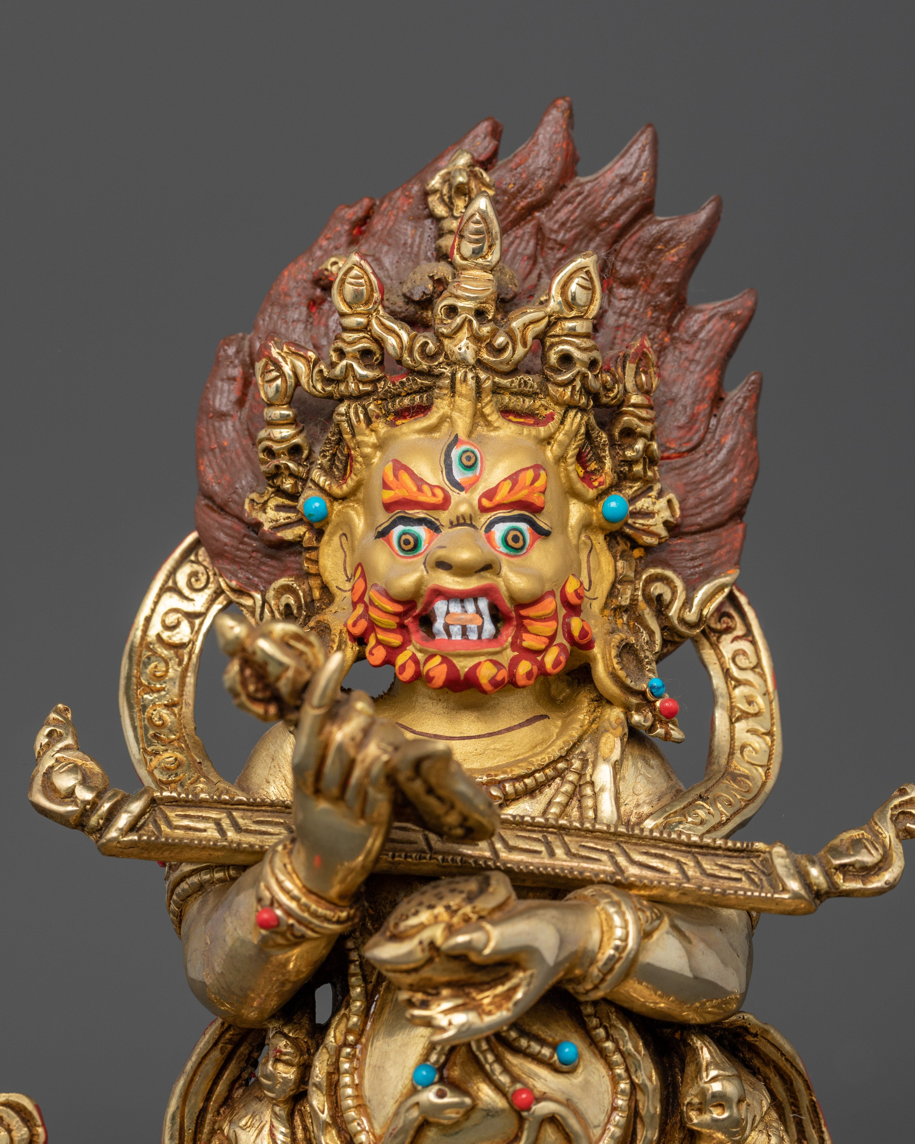 Close up Shakya Mahakala five-skull crown kartika knife kapala details