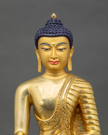 Close up Shakyamuni Buddha gold-painted face 