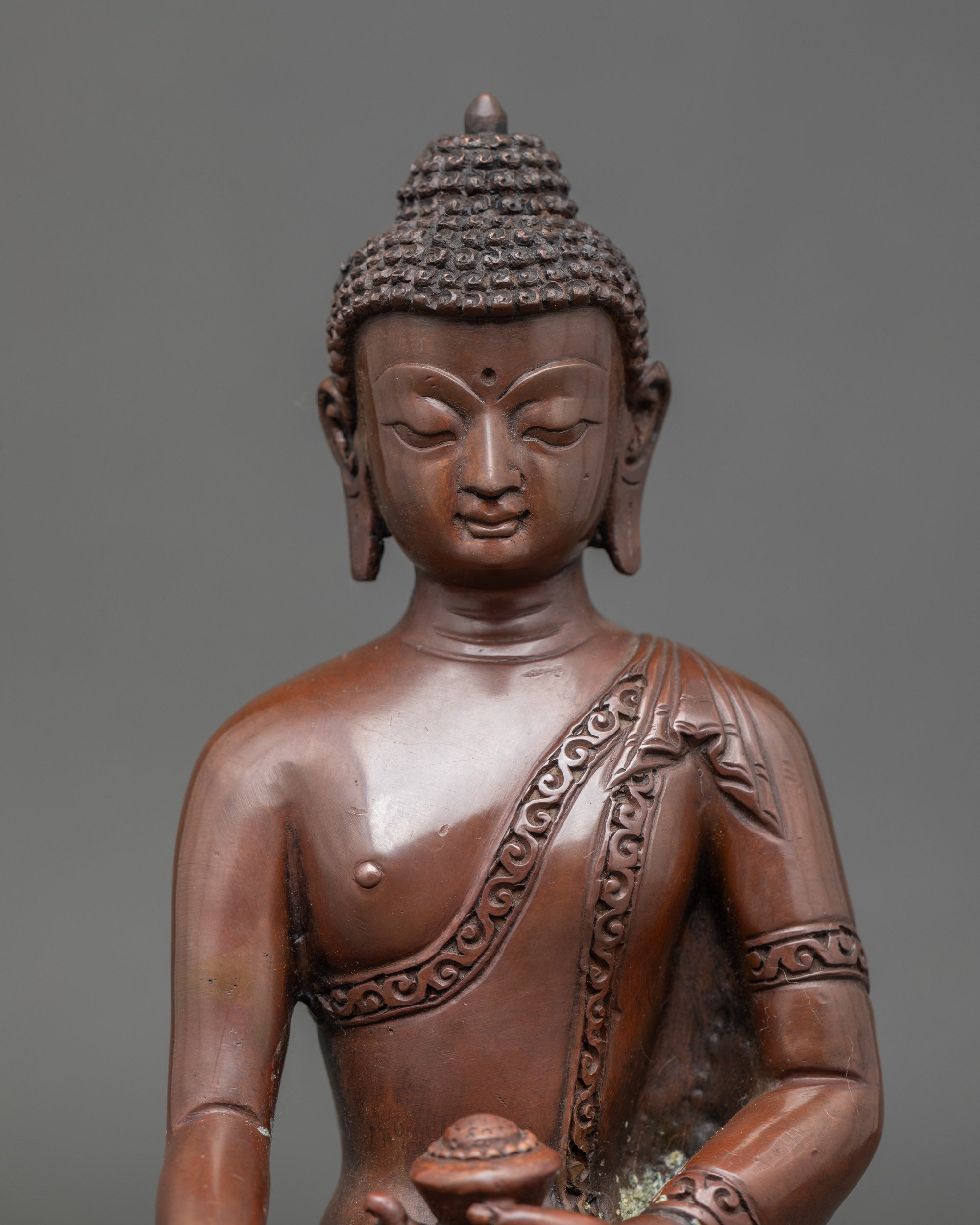 Close up Shakyamuni Buddha sculpture with oxidized copper finish, Nepalese craftsmanship