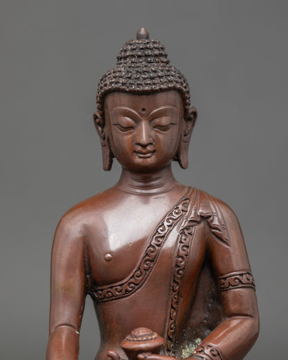 Close up Shakyamuni Buddha sculpture with oxidized copper finish, Nepalese craftsmanship
