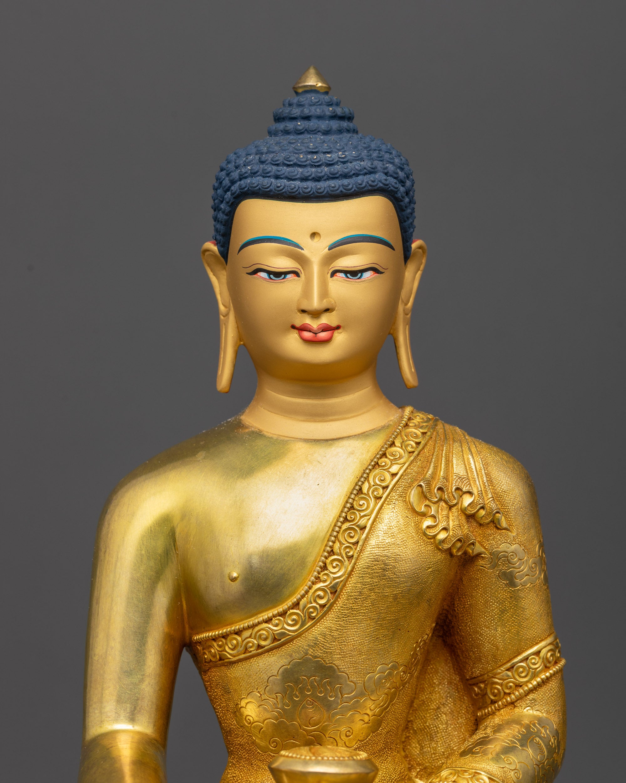 Close up Shakyamuni Buddha serene face with intricate Ashtamangala robe details