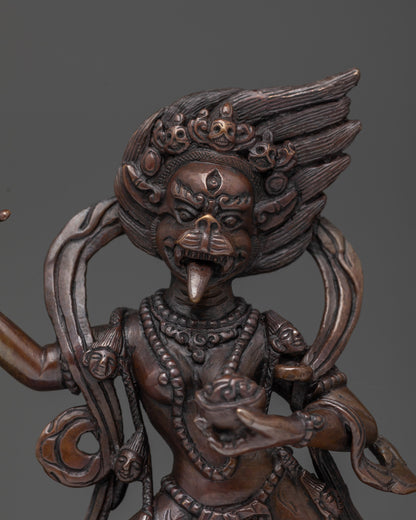 detailed lion-faced copper figurine