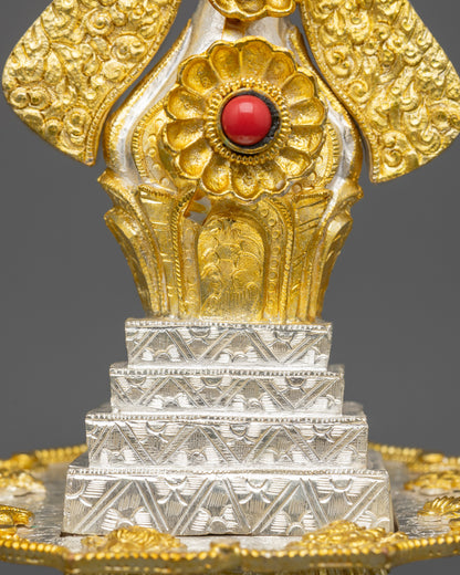 Close up Tibetan Torma adorned with semi precious stones gold silver plated ritual offering