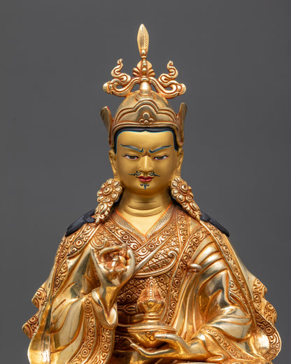 Close up Tsokye Dorje gold-gilded face showing semi-wrathful expression and crown details
