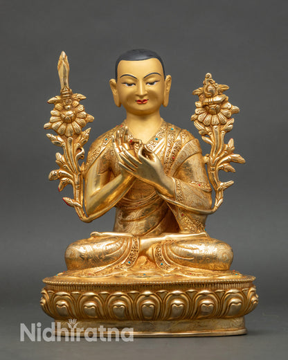 Close up Tsongkhapa meditative face with intricate robes and motif patterns