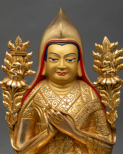 Close up Tsongkhapa statue showing gold-painted face, copper body, and sacred details