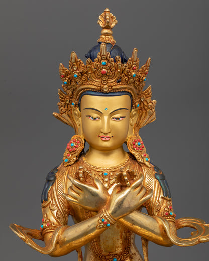 Close up Vajradhara crossed arms holding vajra bell semi-precious stone details