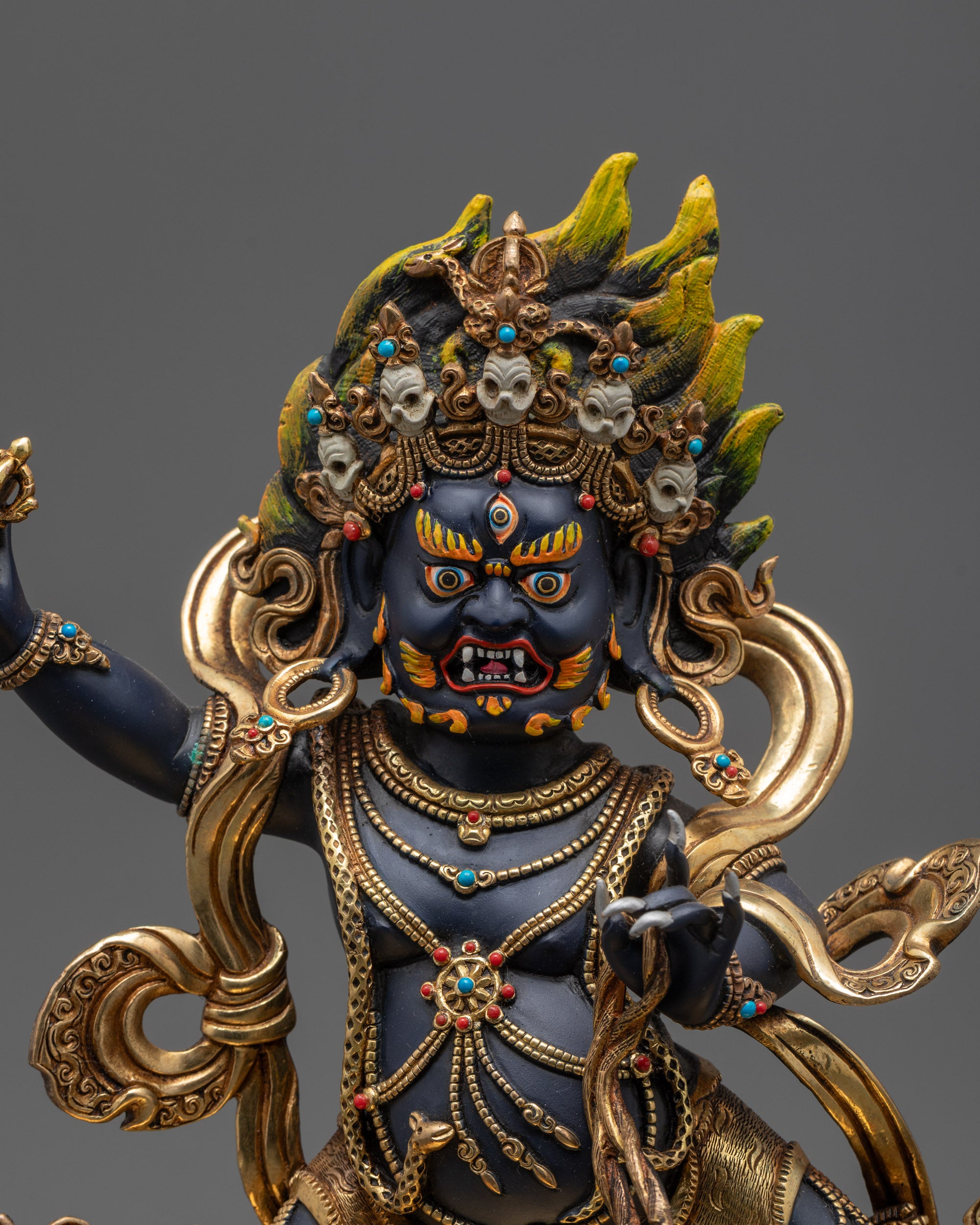 Close up Vajrapani Nepalese artisan statue holding vajra and lasso
