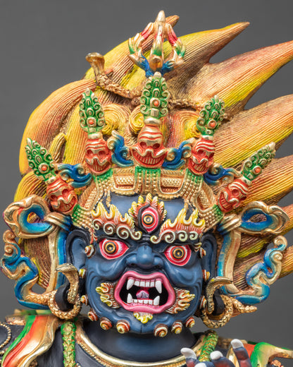 Close up Vajrapani face in copper with semi-precious stones