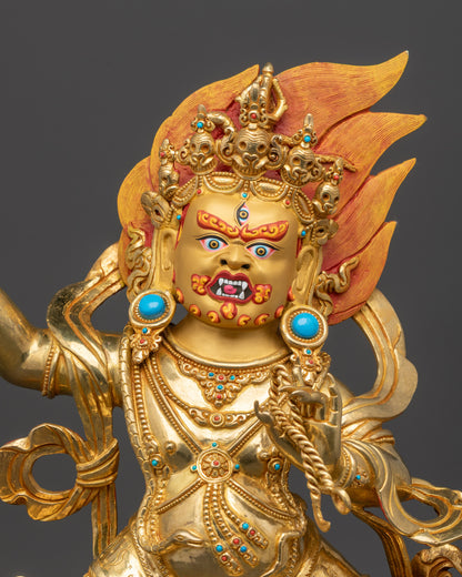 Close up Vajrapani statue showing hand-carved robe, vajra, and lasso details