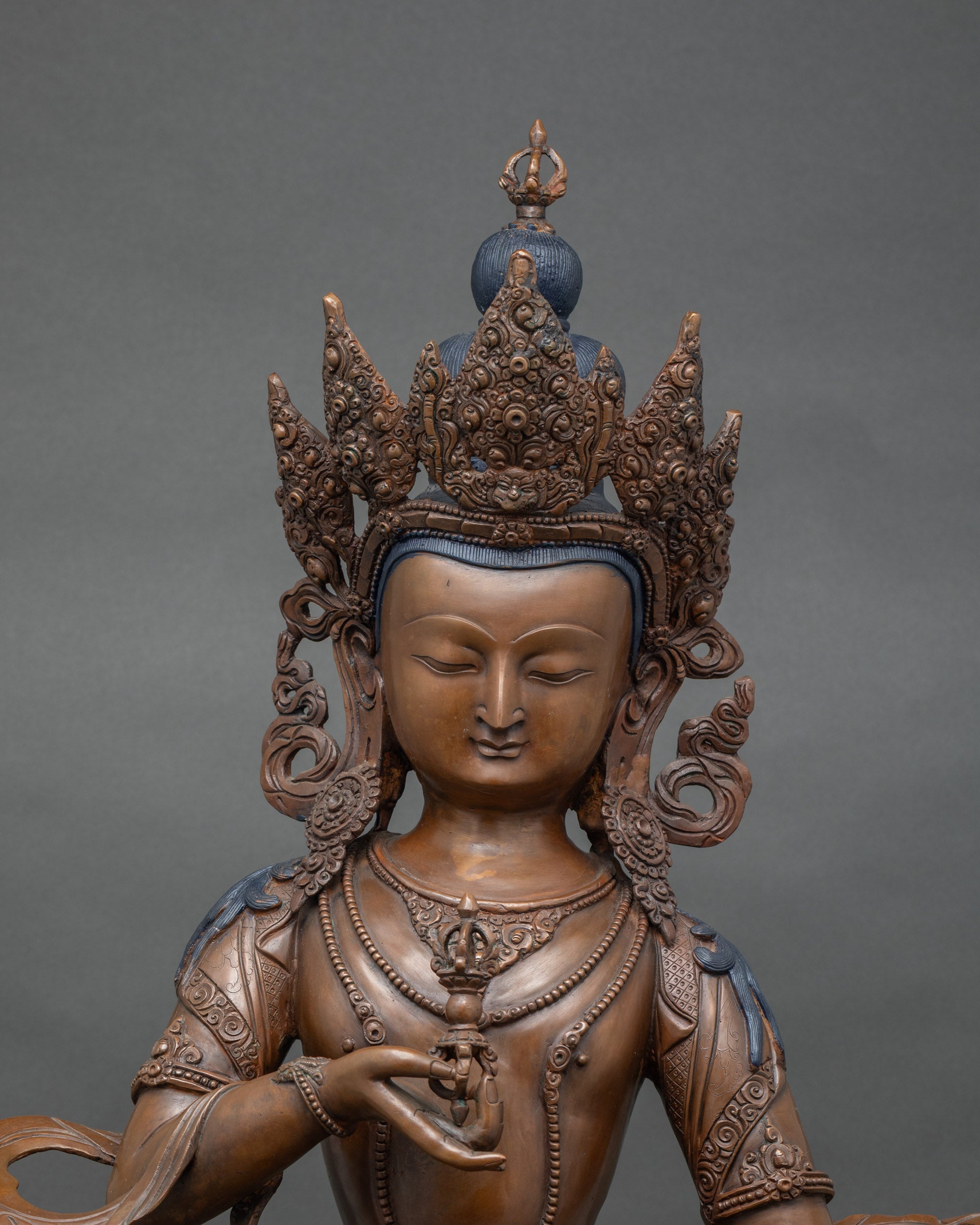 Close up Vajrasattva holding vajra and bell | handcrafted Newari statue from Patan Nepal
