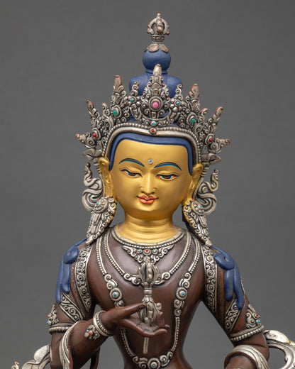 Close up Vajrasattva holding vajra and bell semi-precious stones Himalayan art