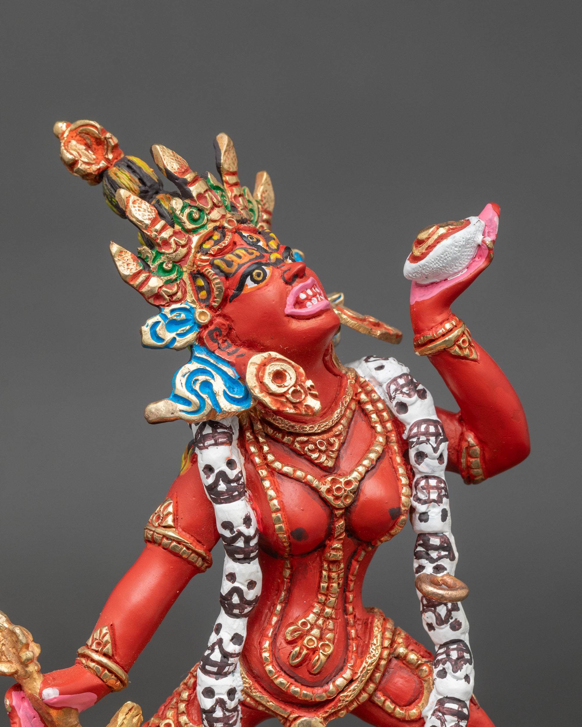 Close up Vajrayogini face five-skull crown garland tantric goddess Nepalese art