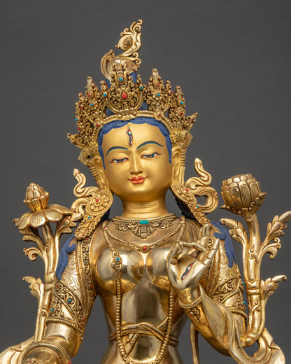 Close up White Tara golden face seven eyes jeweled crown Buddhist art