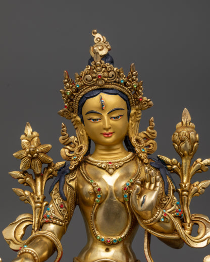 Close up White Tara’s face with seven seeing eyes and gold-gilded details