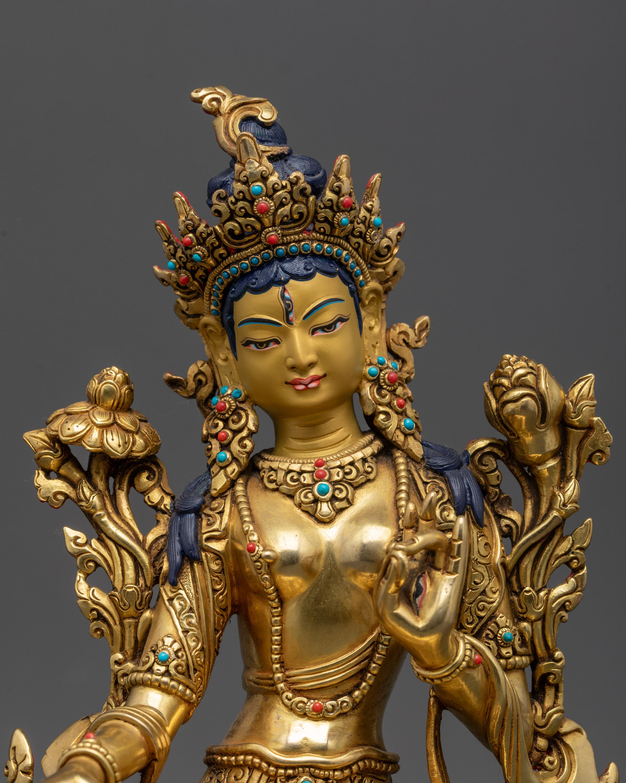 Close up White Tara statue showing seven seeing eyes and Five-Jeweled Crown