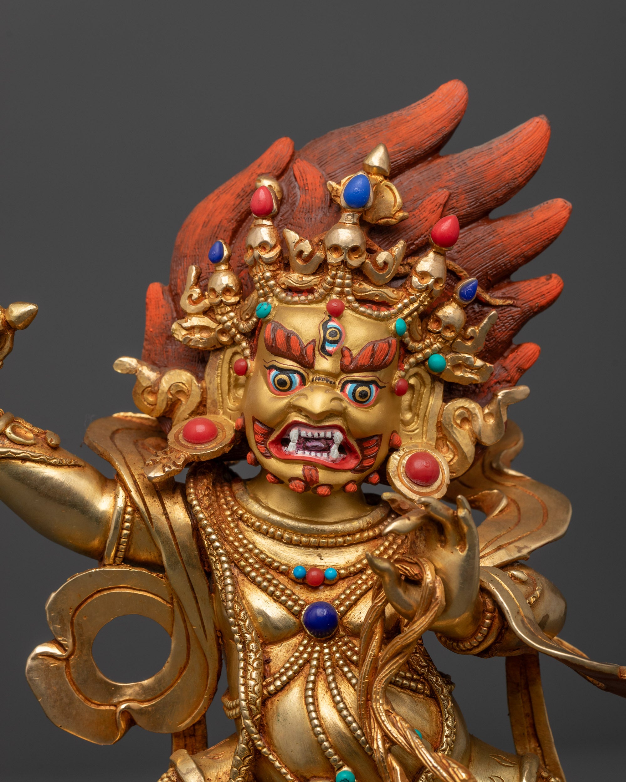 Close up Wrathful Vajrapani Statue showing fierce face, Vajra, Lasso, and Wrathflame halo
