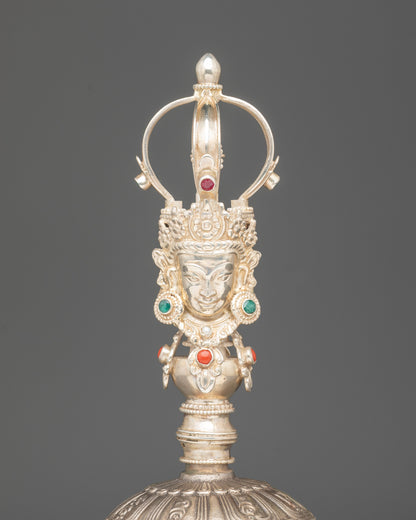 Close up bronze bell with silver handle | Deity carved with five-jewelled crown