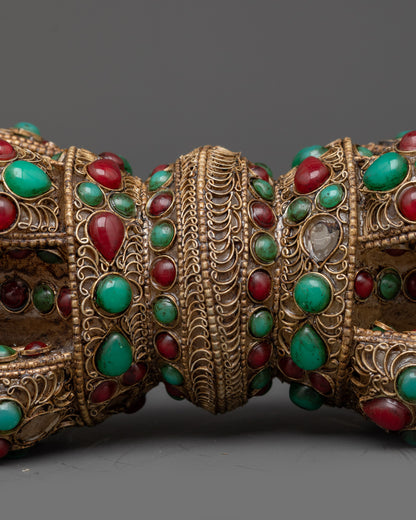 Close up copper Dorje with turquoise, coral, and crystal core