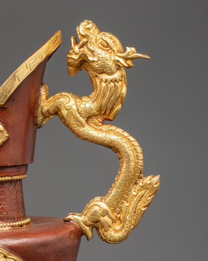 Close up dragon handle bumba showing gold accents and hand-painted sacred details