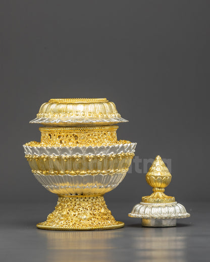 Close up floral design on Himalayan copper rice pot with gold silver finish