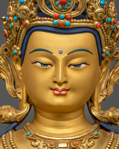 Close up gold-gilded face of Manjushri Bodhisattva with five-jeweled crown
