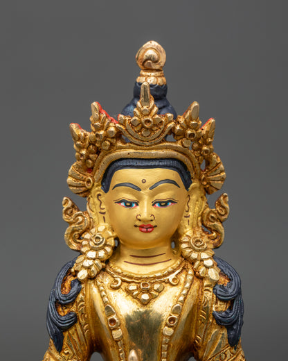 Close up gold-painted face Bodhisattva Amitayus statue handmade Newari craftsmanship