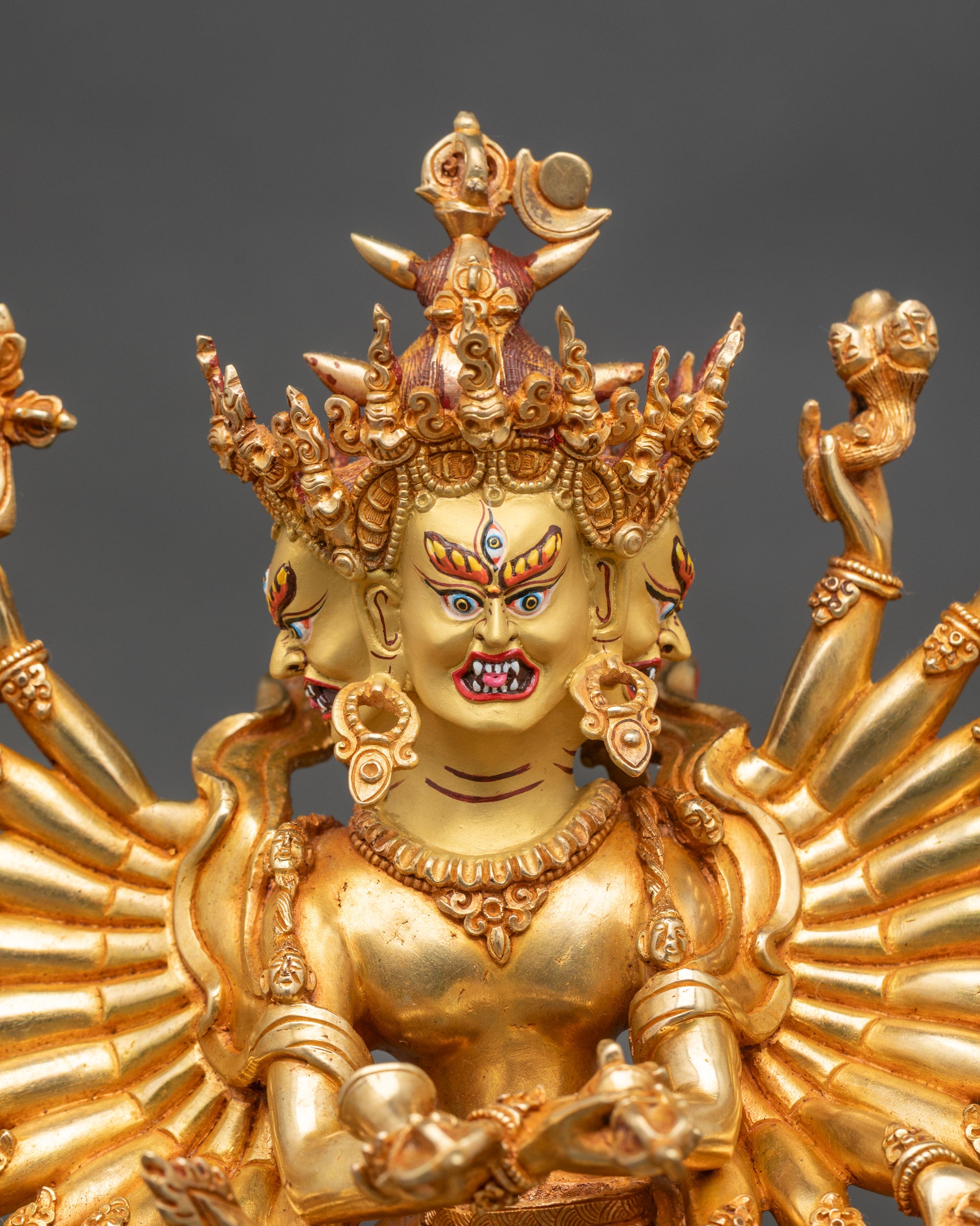 Close up gold-painted face Kalachakra Buddhist deity handcrafted by Newari artisan