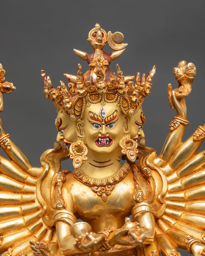 Close up gold-painted face Kalachakra Buddhist deity handcrafted by Newari artisan