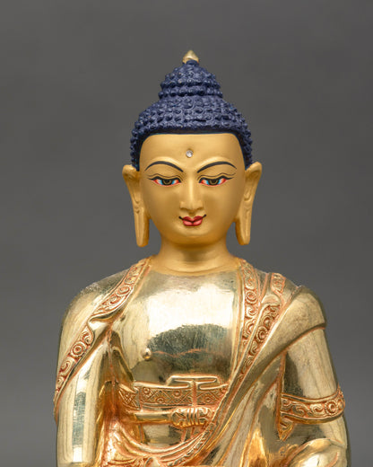 Close up gold-painted face Shakyamuni Buddha handmade Patan Newari art