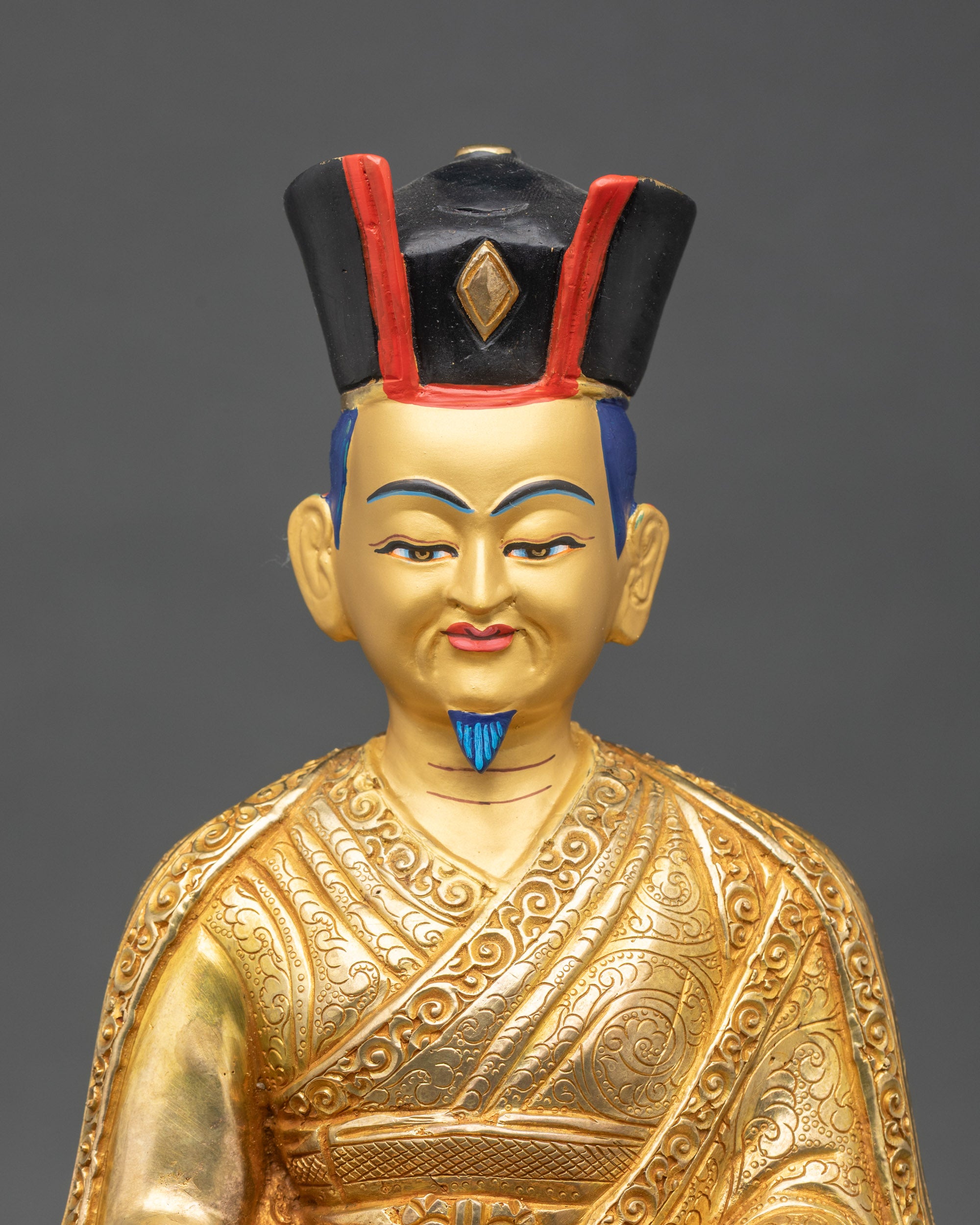 Close up gold painted face 2nd Karmapa Karma Pakshi statue with Black Crown detail