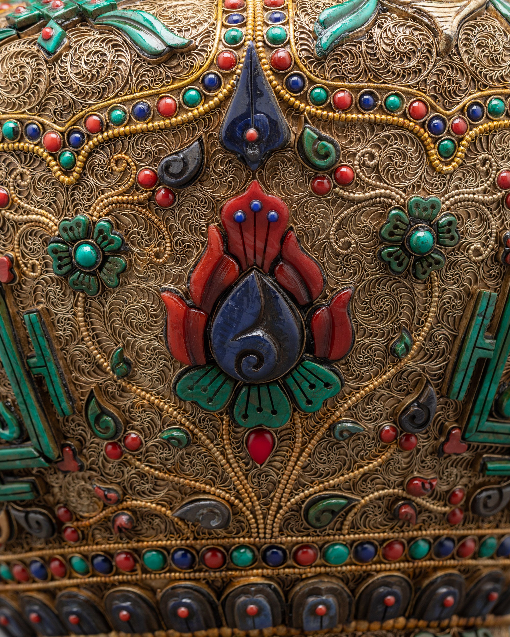 Close up intricate coral, turquoise, and lapis lazuli on Dhupur Rice Pot