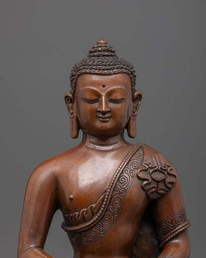 Close up of Amida Buddha’s serene face and intricate lost wax casting details