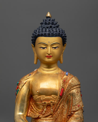 Close up of Amida Nyorai Buddha showing intricate robe patterns and semi-precious stones