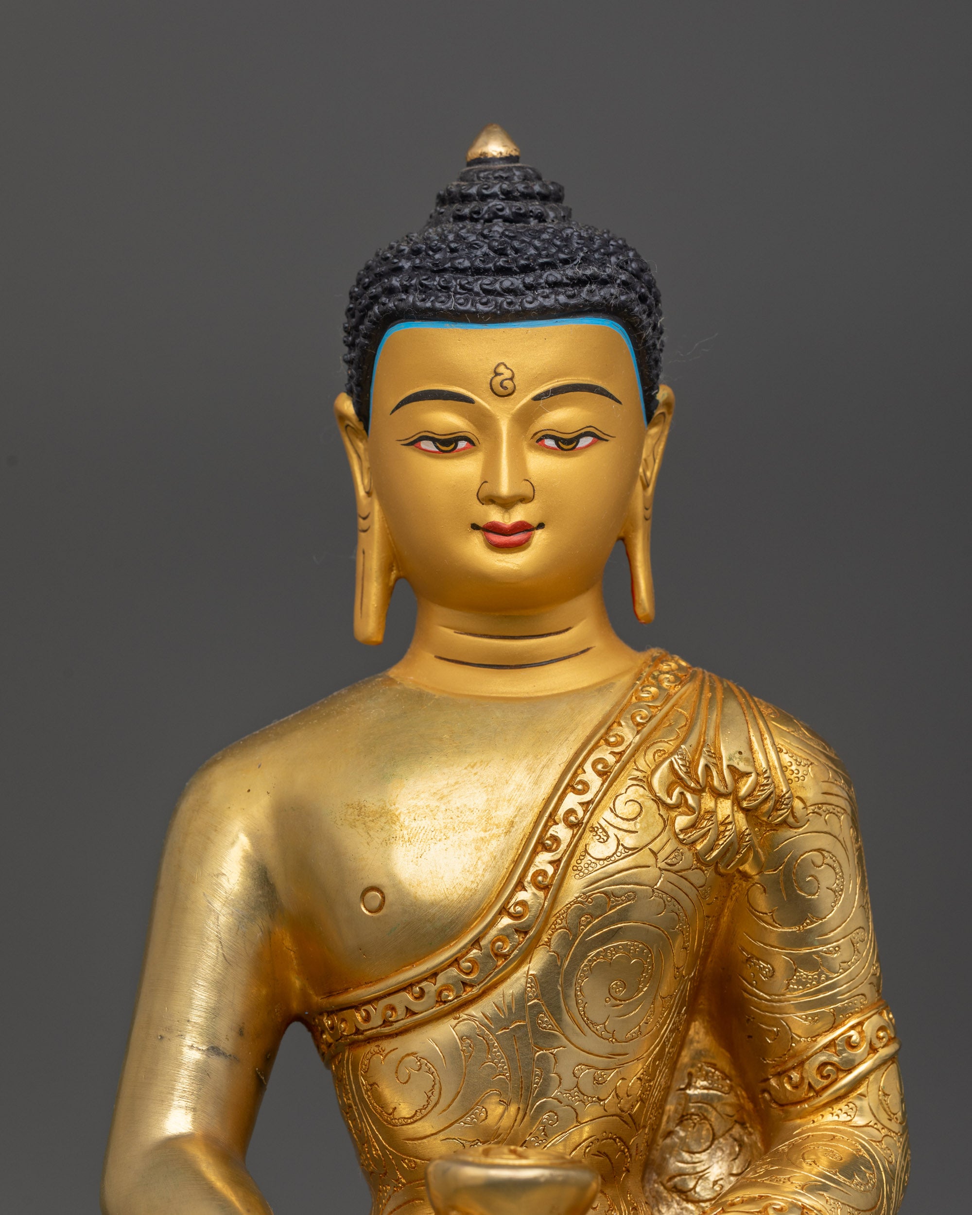 Close up of Amitabha Buddha Statue showing carved robe and Shiny Body