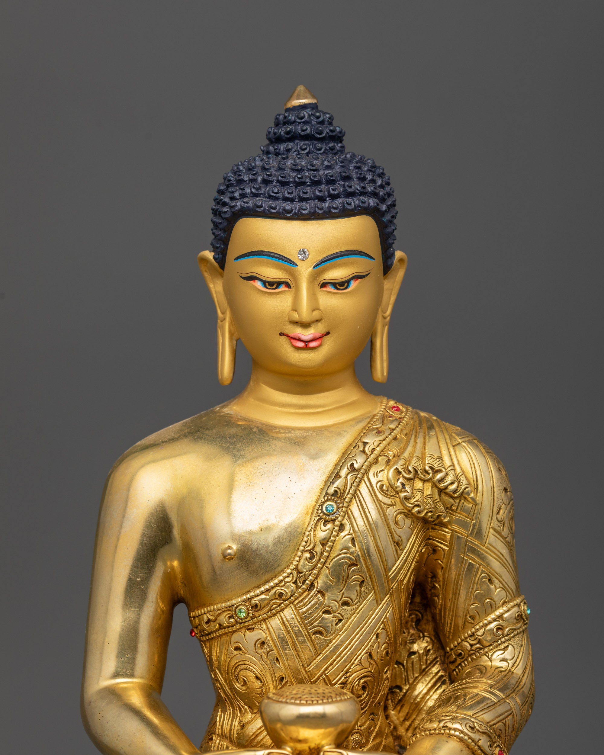 Close up of Amitabha Buddha statue robe details and semi-precious stones craftsmanship