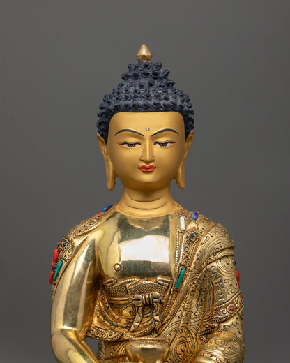 Close up of Amitabha Buddha statue showing polished carved garment and intricate patterns