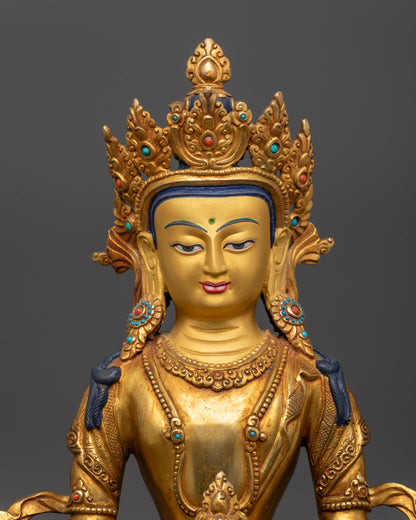 Close up of Amitayus Statue holding sacred nectar vase with gold fire-gilded body
