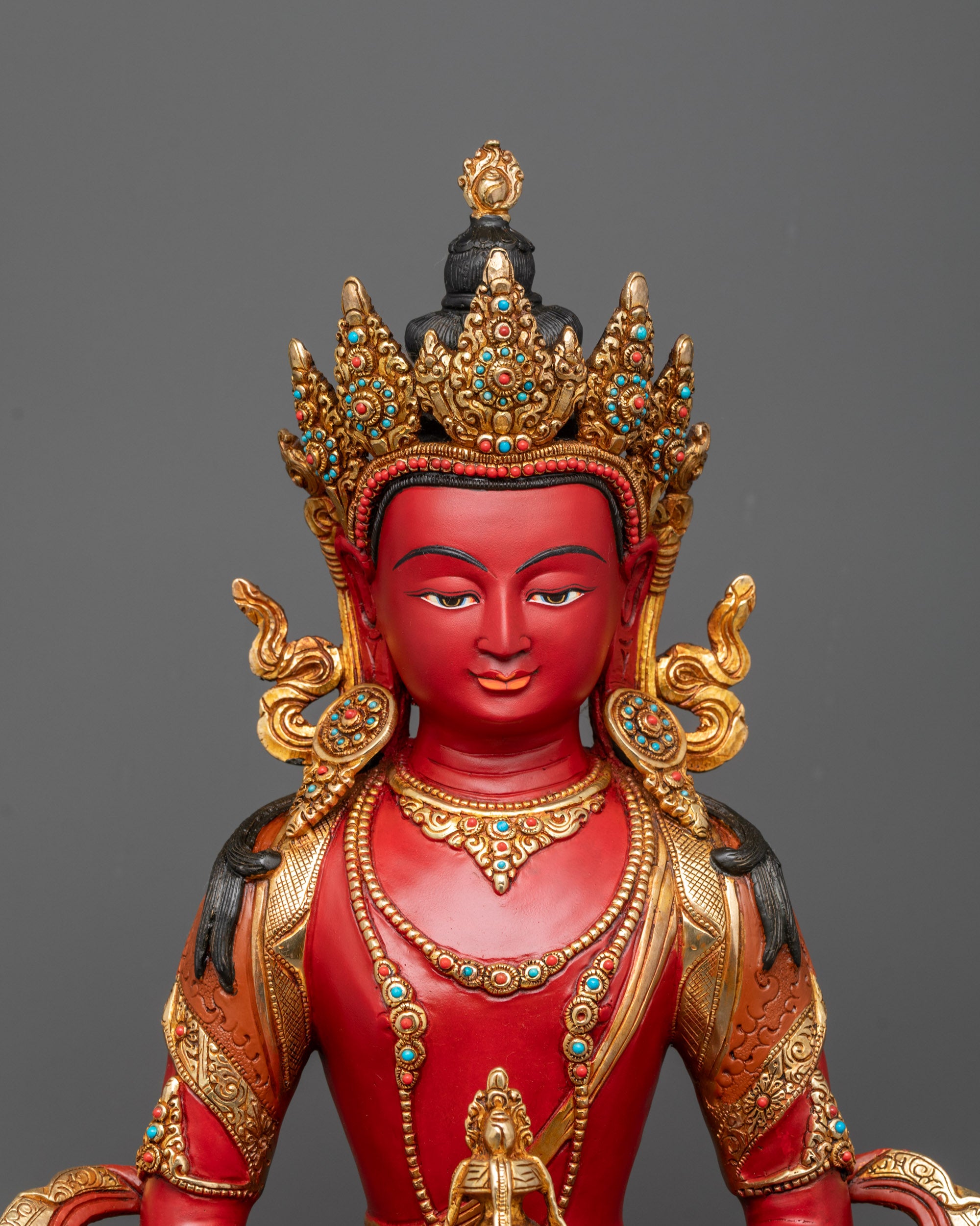 Close up of Amitayus statue highlighting nectar vase, jewelry, and semi-precious stones