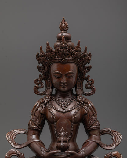 Close-up of Amitayus statue highlighting detailed machine-crafted features and rich oxidized tone
