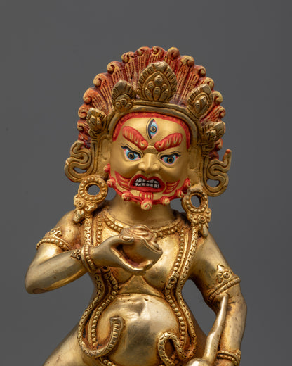 Close up of Black Jambhala face with third eye, serpent ornaments, and mongoose