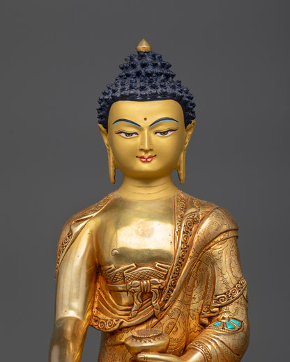 Close up of Buddha Shakyamuni statue showing intricate carved garments and serene expression

