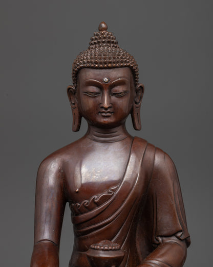 Close up of Buddha statue holding begging bowl in earth-touching mudra