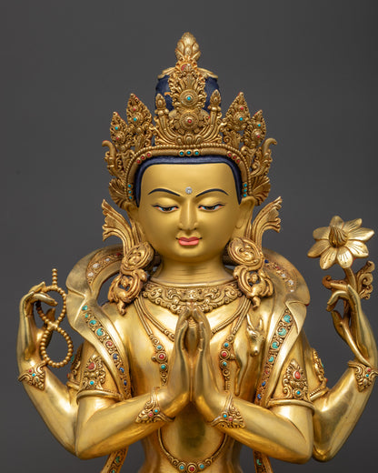 Close up of Chenrezig Statue highlighting gold-gilded base and detailed jewelry
