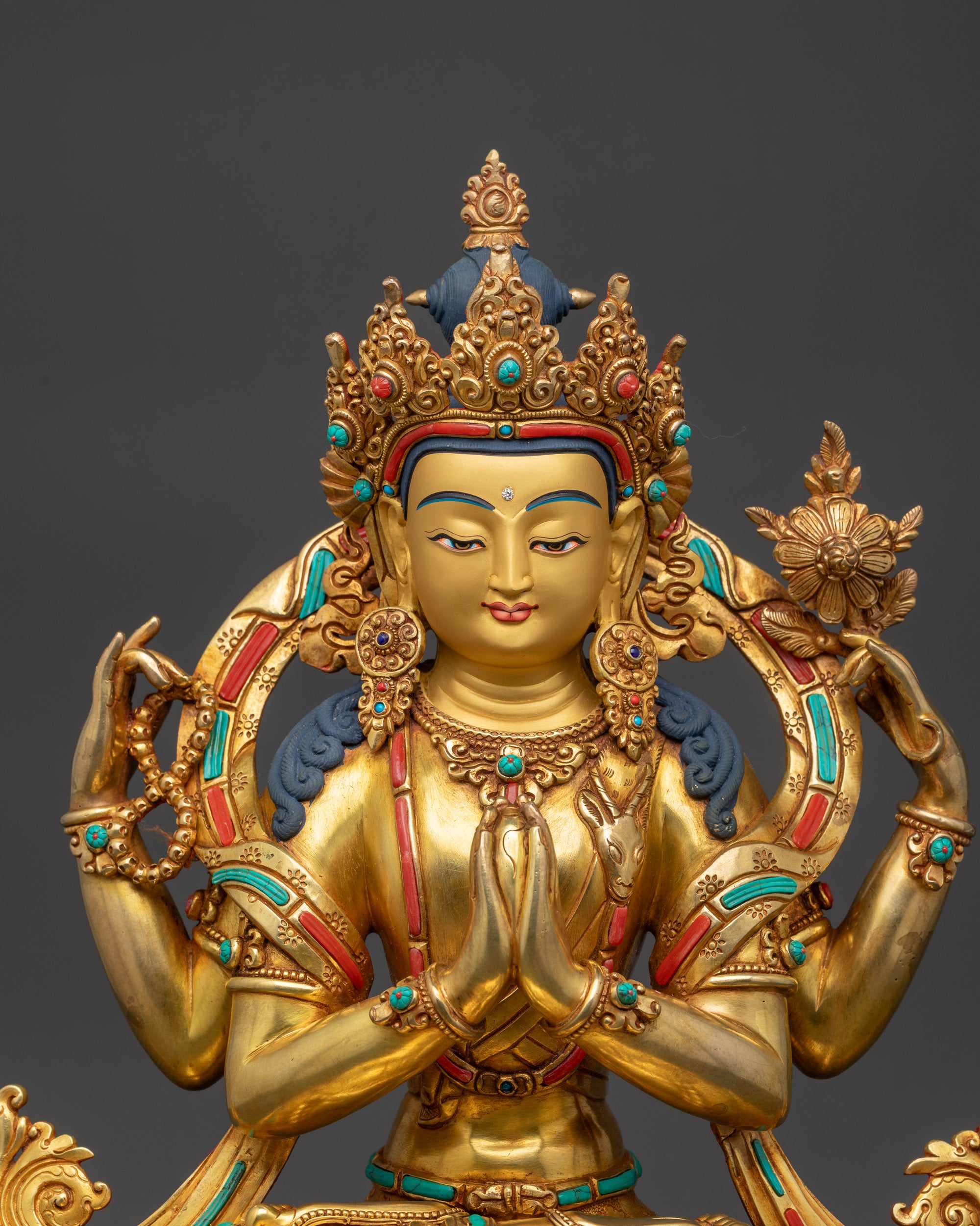 Close up of Chenrezig Statue showing five-jeweled crown and semi-precious stones